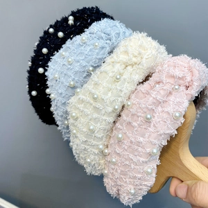Knotted feather yarn headbands with pearl accents in black, blue, beige, and pink colors