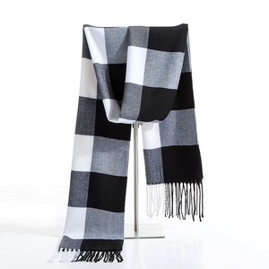 Classic black and white buffalo check long scarf with tassels on metal T-stand