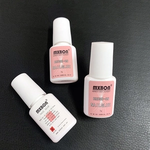 Three bottles of MXBON 7g brush-on nail glue displayed on a professional black background