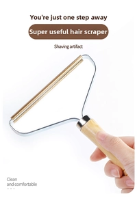 Manual lint remover with double-sided copper head and ergonomic wooden handle for clothes