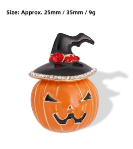 Detail of Halloween pumpkin brooch with black witch hat and crystal accents