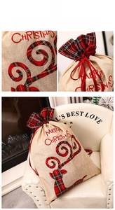 Detail of burlap Christmas gift bag with plaid reindeer applique and red drawstring