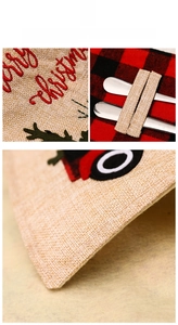 Detailed embroidery of Merry Christmas text and red truck on burlap cutlery pouch