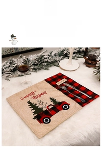 Christmas placemat with red truck and buffalo plaid pattern on burlap fabric