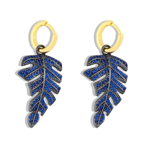 Elegant gold-plated hoop earrings with navy blue crystal-pave tropical leaf pendants