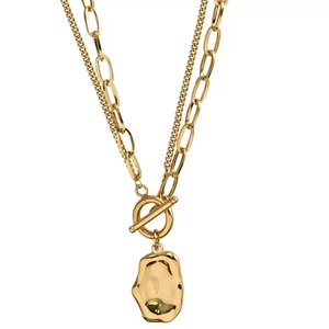 Double-layered gold necklace featuring a T-bar toggle clasp and irregular metal pendant