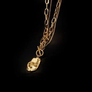 Double layered gold chain necklace with vintage irregular pendant and T-bar toggle clasp