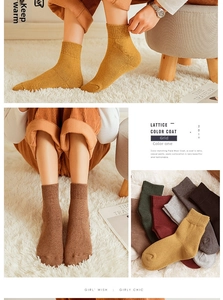 Detail of warm winter wool socks with ribbed texture in various solid earthy colors
