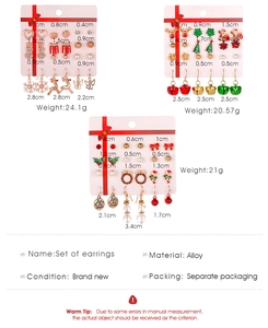 Close-up of 9-piece Christmas earring set featuring Santa, reindeer, and snowflakes