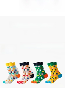 Detailed set of four mid-calf cotton socks with colorful polka dot patterns and contrast heels