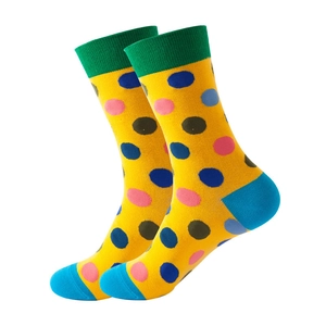 Polka dot crew socks in bright yellow with colorful spots and contrasting green cuffs