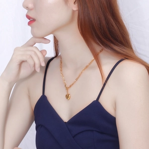 Minimalist gold heart pendant necklace for women in polished stainless steel finish
