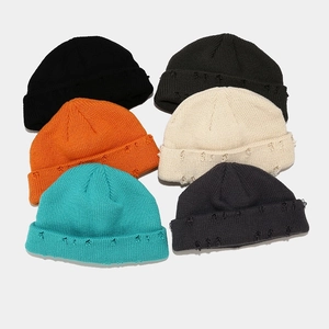 Unisex distressed knit beanies in multi-color options featuring vintage ripped edge details