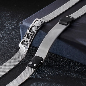 Macro view of stainless steel mesh bracelets with mechanical gear and brushed metal details