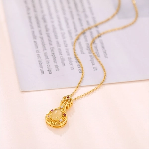 18K gold violin necklace with cat-eye teardrop pendant and micro-set zircon stones