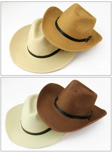 Detailed weave of straw cowboy hats with black leather belts and metal buckles
