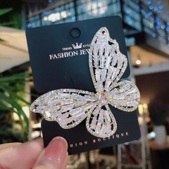 Macro shot of a silver butterfly hair clip with sparkling K9 crystals and zircon