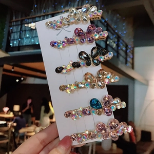 Set of 6 colorful butterfly hair clips with sparkling K9 crystals on a white card