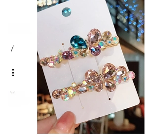 Macro shot of colorful K9 crystal butterfly hair clips with zircon on a metal base