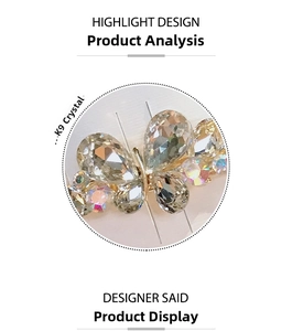Macro detail showing K9 crystal butterfly wing inlay on a gold-plated metal hair clip
