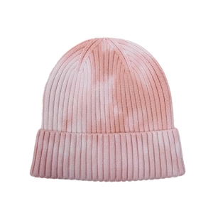 Pink and white tie-dye knit beanie hat with thick ribbed texture and folded brim