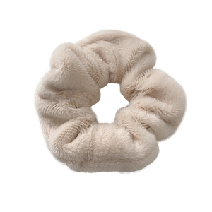 Minimalist beige plush scrunchie with soft faux fur texture for women hair styling