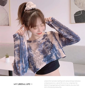 Detail of blue and white tie-dye cropped mesh top with breathable long sleeves
