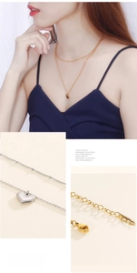 Doppellagige Gold- und Silberketten mit Herzanhängern und eleganten Perlenketten für Damen