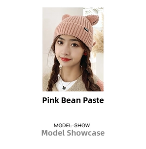 Detail of bean paste pink knit hat with cat ears and black CAT label on side