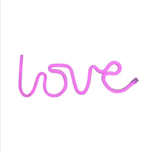 Pink LED neon sign in LOVE shape for creative proposal and party atmosphere decor