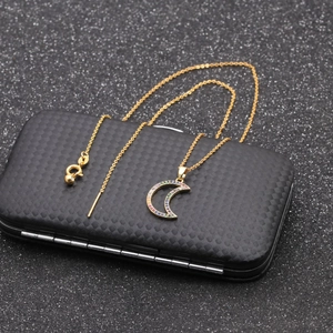 Elegant gold celestial necklace and bracelet set with moon pendant and colorful gemstones