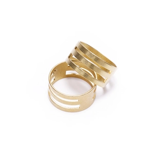 Golden brass open ring jump ring opener tool with triple hollow stripe design on white background