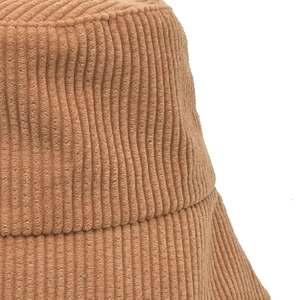 Detailed texture of camel corduroy bucket hat with focus on soft fabric and durable stitching