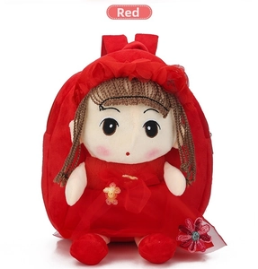 Close-up of cute plush doll backpack with red lace dress and sequined floral detail