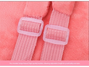Adjustable shoulder strap detail with high-quality plastic buckle on pink plush backpack