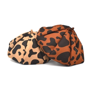 Retro wool cow print beret hats in beige and caramel colors with a structured octa design