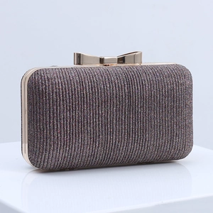 Sparkly red pleated evening clutch bag with golden metal bow clasp and rigid shell