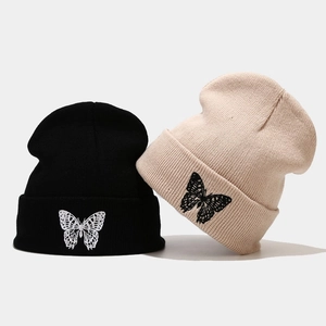 Winter butterfly embroidery knit beanie in black and beige with warm ribbed texture