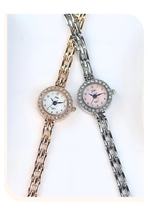 Detail of luxury rhinestone quartz watches in rose gold and silver finish for women