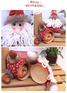 Detailed view of Santa Claus gift box with knitted fabric and plush faux fur texture