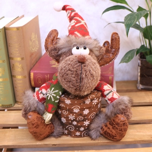 Christmas reindeer plush figurine with knitted scarf on snowflake gift box base