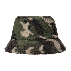 Detailed macro view of the thick sherpa fleece texture on a camouflage bucket hat