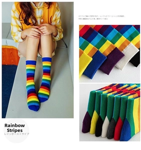 Detailed knit texture of colorful rainbow striped crew socks in a premium cotton blend