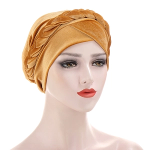 Detailed view of ginger gold velvet turban hat featuring a braided twist design and soft texture