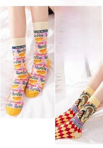 Close-up of cotton mid-calf socks with cute hot dog pattern and argyle portrait design