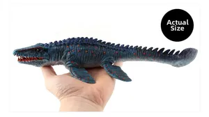 Detailed scale view of a blue Mosasaurus toy with orange spots held by a hand