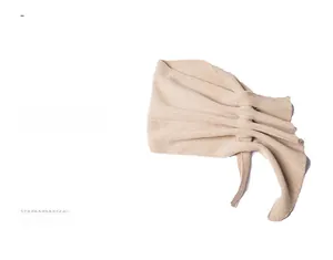 Detail of beige hollow-out knit scarf with elegant ribbed texture and soft fabric finish