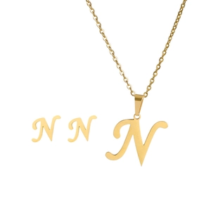 Detailed view of gold stainless steel jewelry set featuring letter N necklace and earrings
