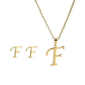 Detailed view of gold plated stainless steel letter F necklace and stud earrings set