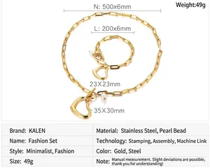 Detail of golden stainless steel jewelry set with heart charms and OT toggle clasp